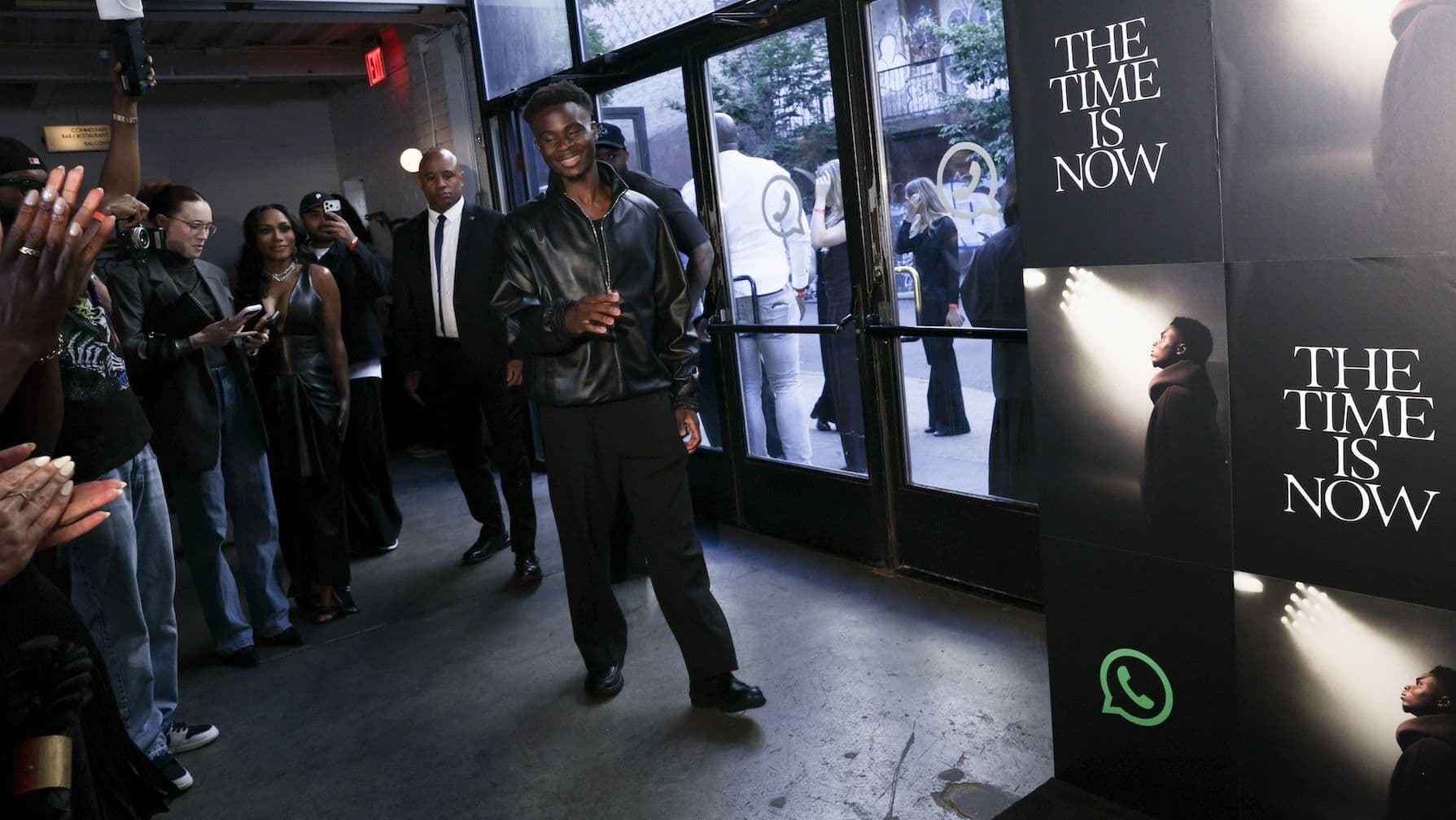man walking into film premiere with crowd