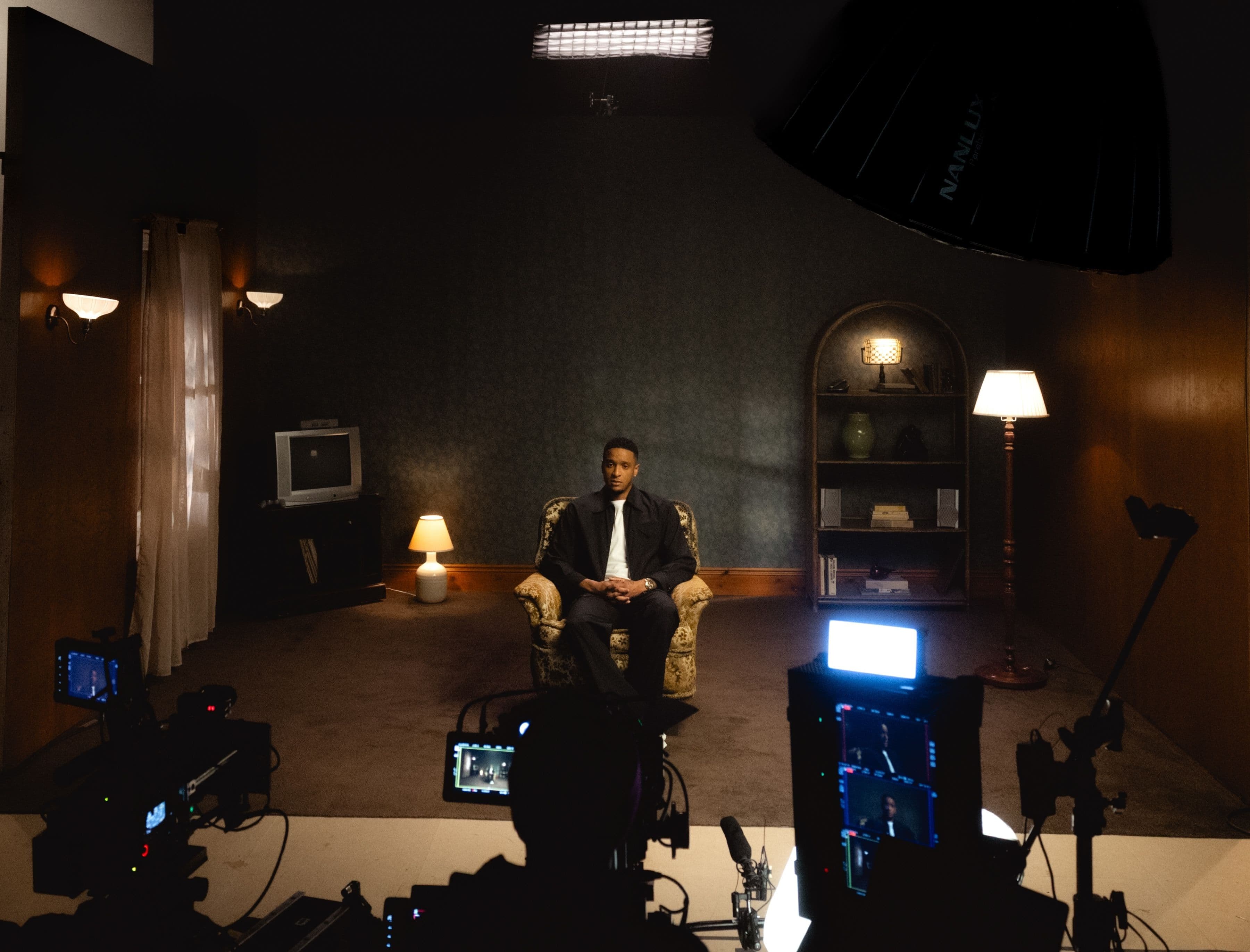 man being interviewed in chair
