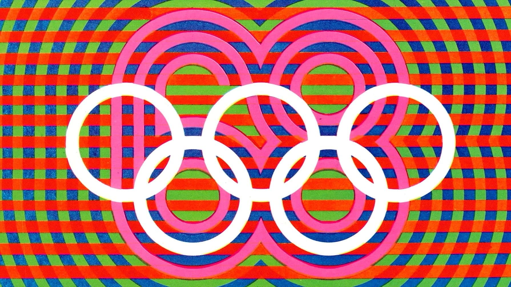 Olympic rings in white over a vibrant, multicolored geometric background with red, blue, green, and pink patterns.